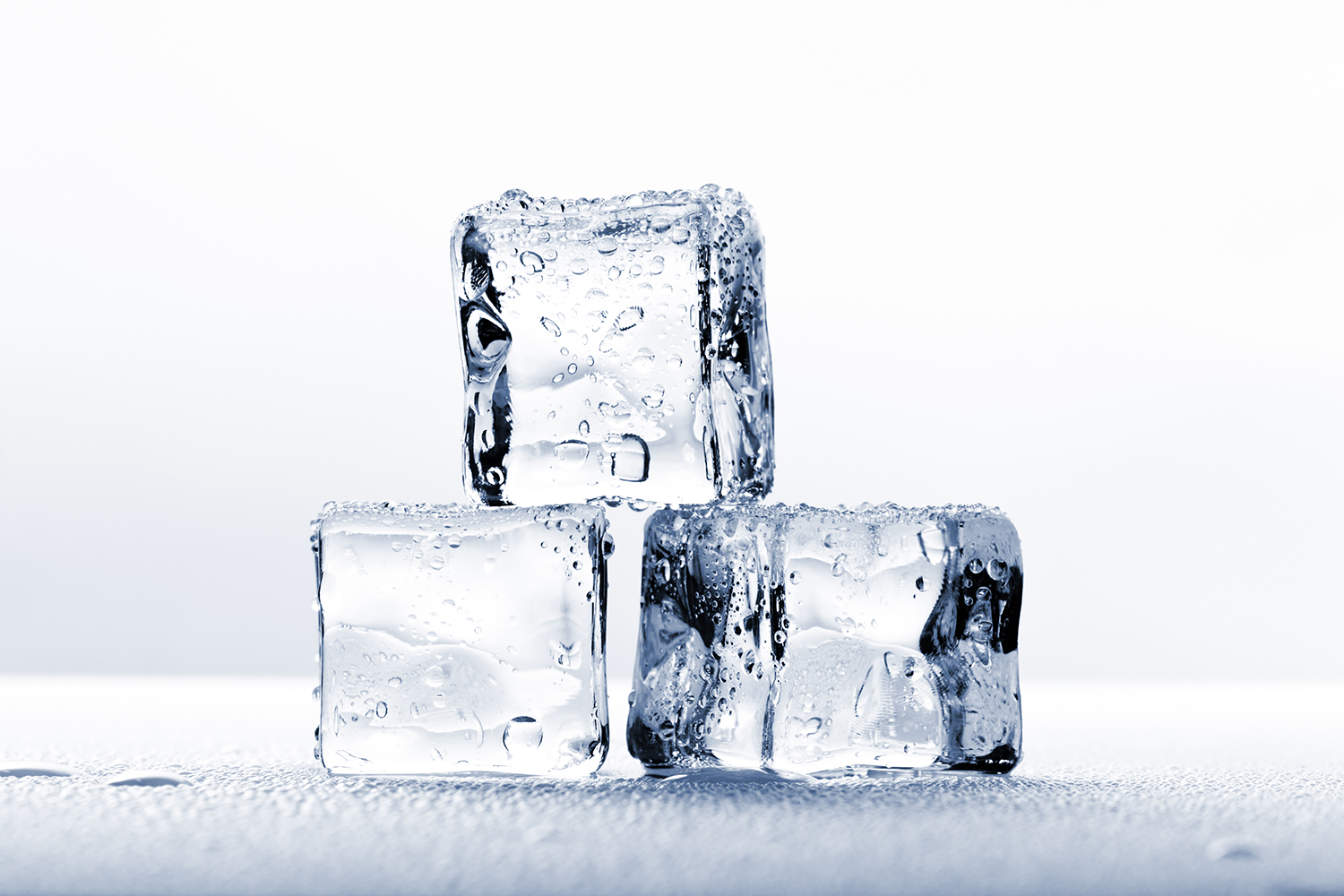 Ice cubes on wet surface