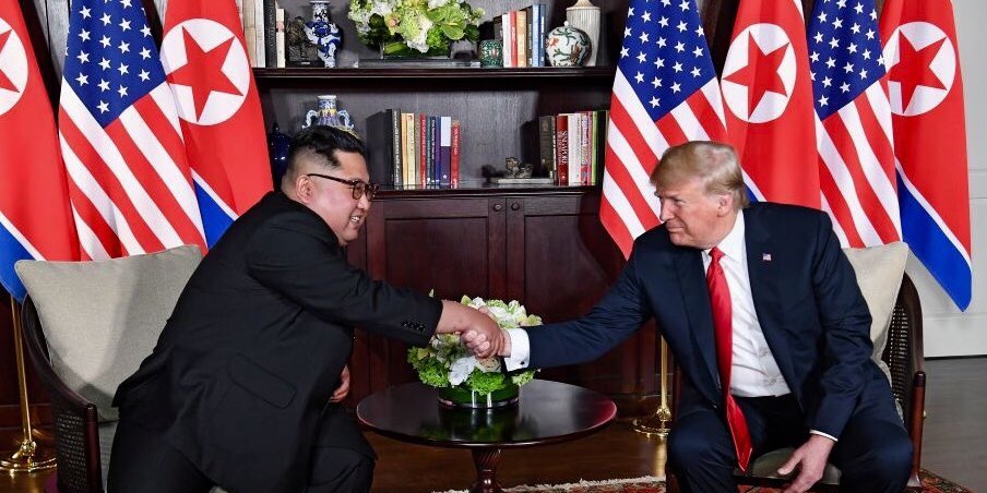 Trump and Kim shake hands in summit room