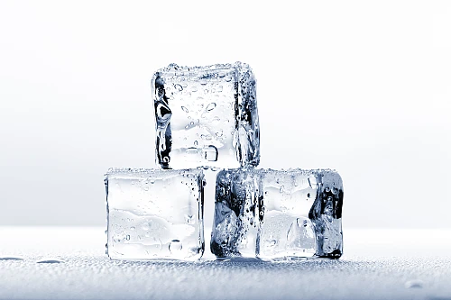 Ice cubes on wet surface